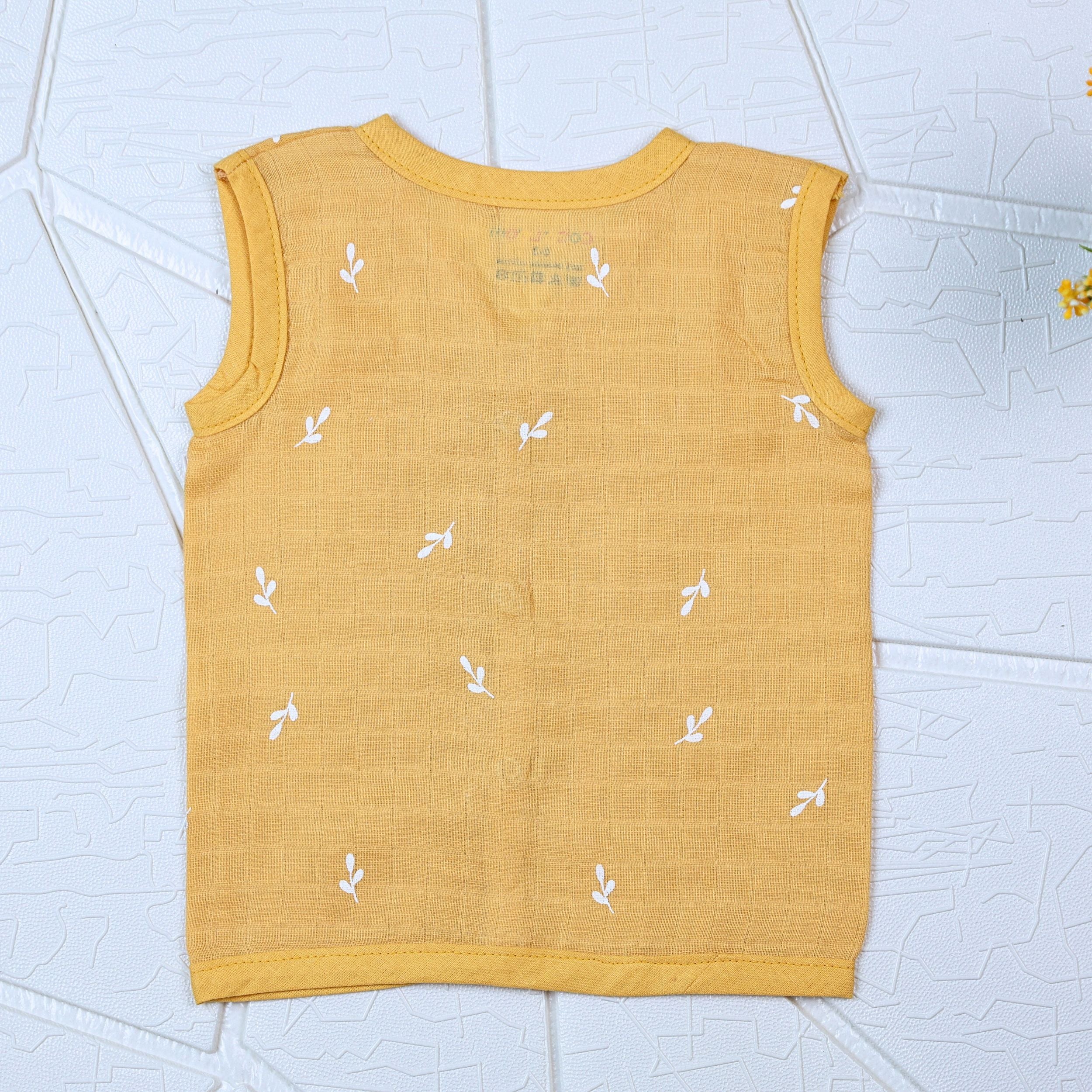 Mustard Sprigs baby sleeveless top in yellow with snap buttons printed with white floral patterns 