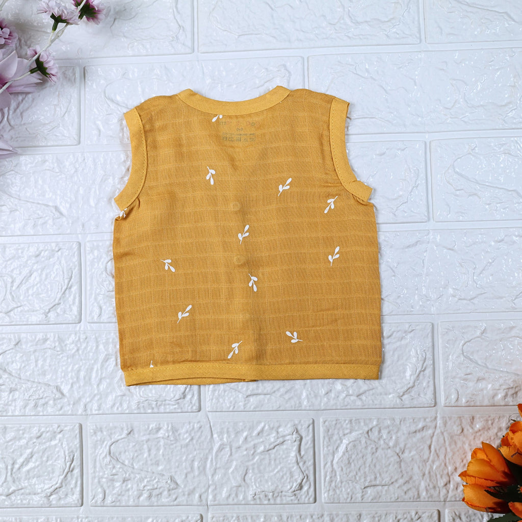 Mustard Sprigs baby sleeveless top in yellow with snap buttons printed with white floral patterns 