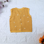 Mustard Sprigs baby sleeveless top in yellow with snap buttons printed with white floral patterns 