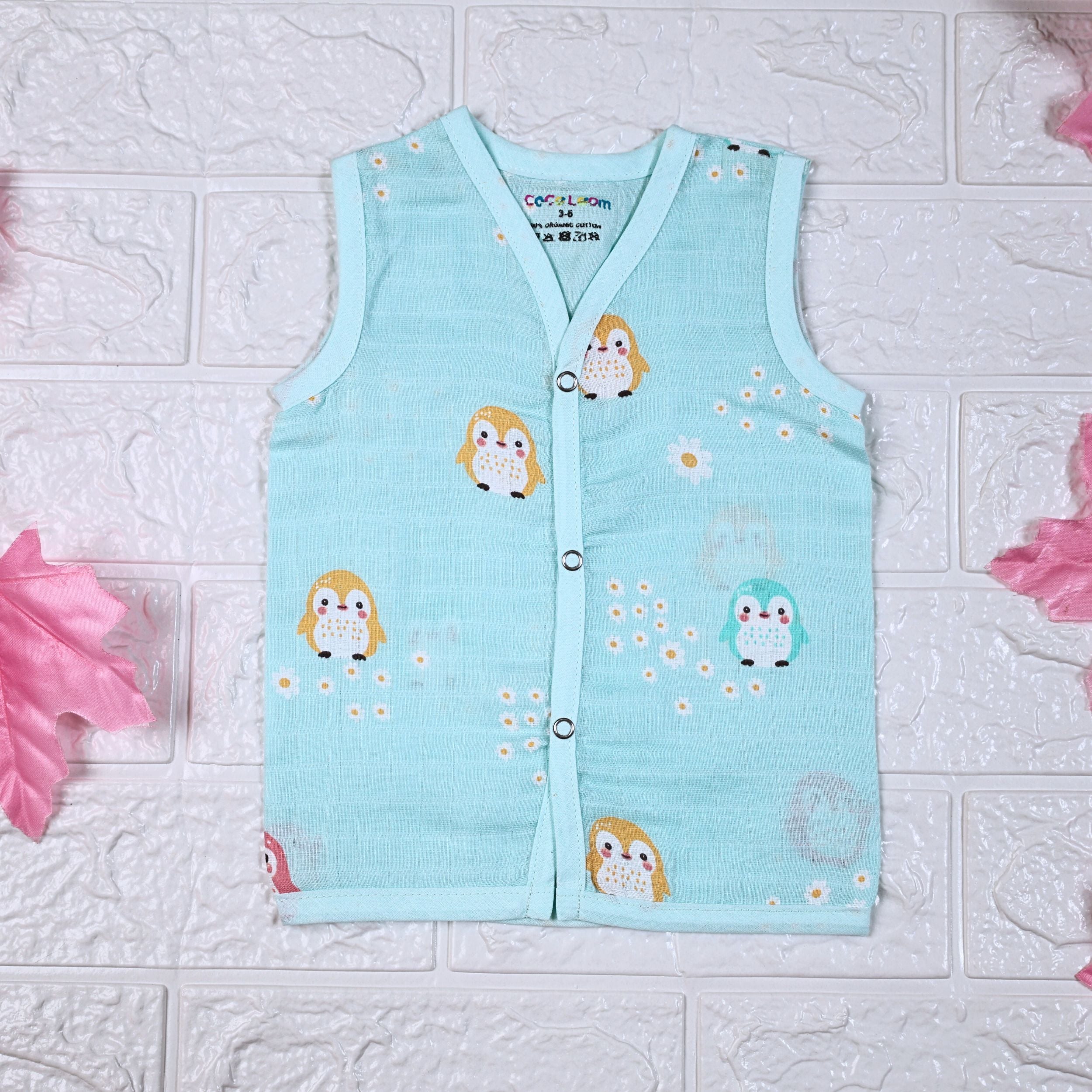 Peppy Penguin baby sleeveless top in turquoise blue with snap buttons printed with penguin patterns