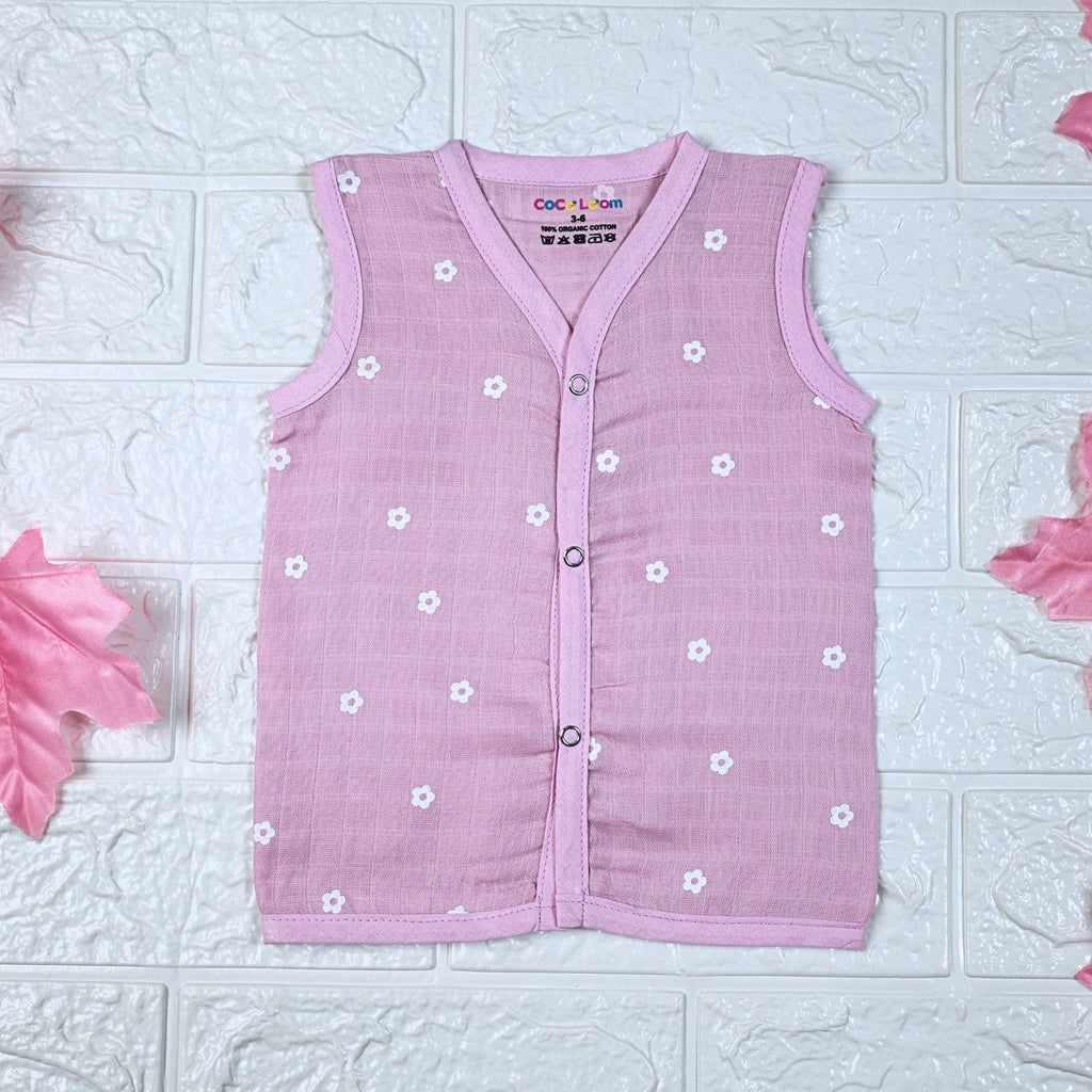 Pink Daisy baby top in pink with snap buttons printed with white floral patterns