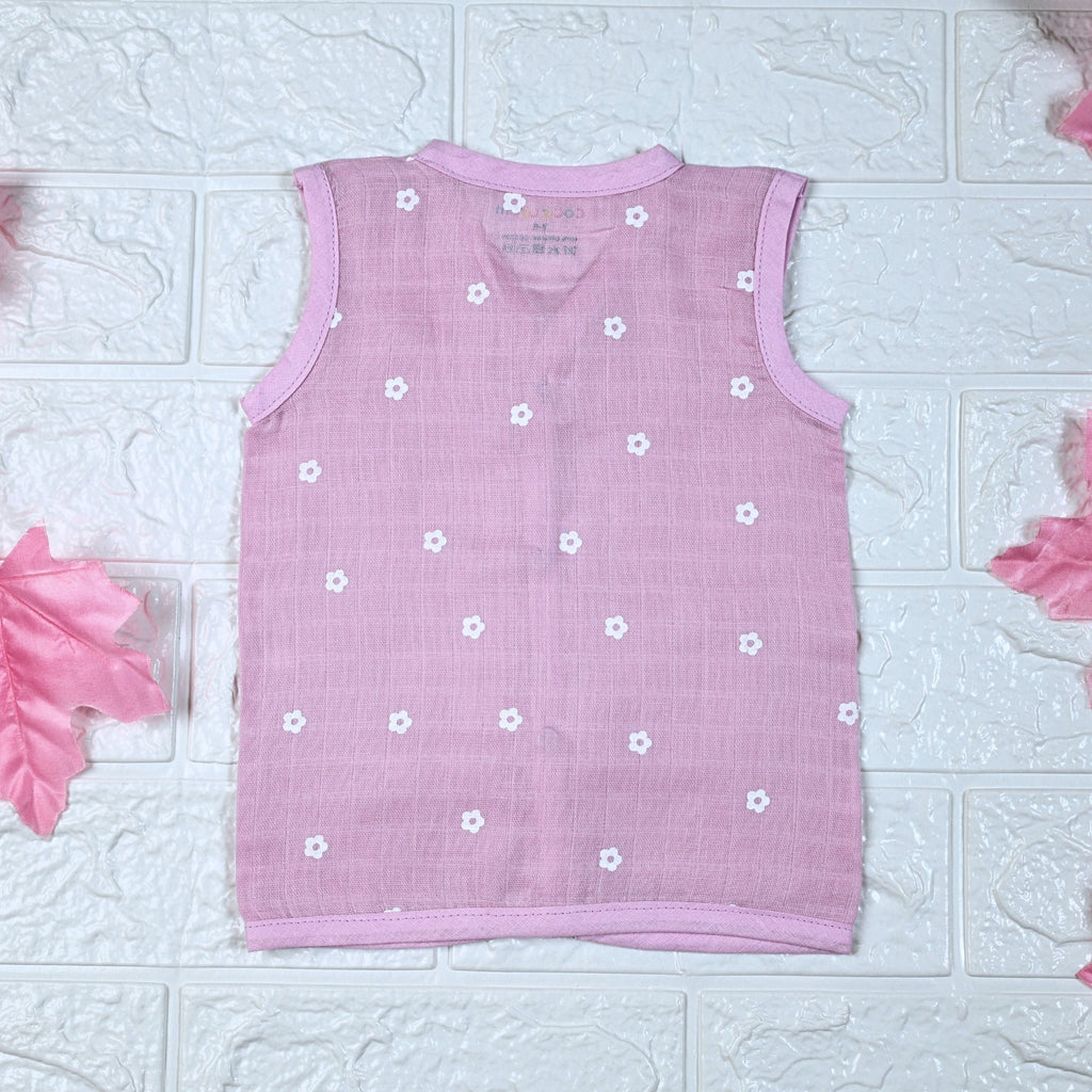 Pink Daisy baby top in pink with snap buttons printed with white floral patterns