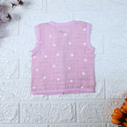 Pink Daisy baby sleeveless top in pink with snap buttons printed with white floral patterns