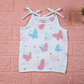 Butterfly Blush baby top in white with tie-up shoulders, printed with pastel butterfly motifs in soft pink and blue tones.