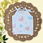 Butterfly Blush baby top in white tie up shoulders, printed with colourful butterfly pattern 