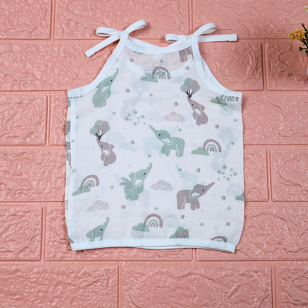 Tiny Tusks baby top in white with shoulder knots, with elephant, clouds and rainbow
 prints in gentle green and brown
 shades.