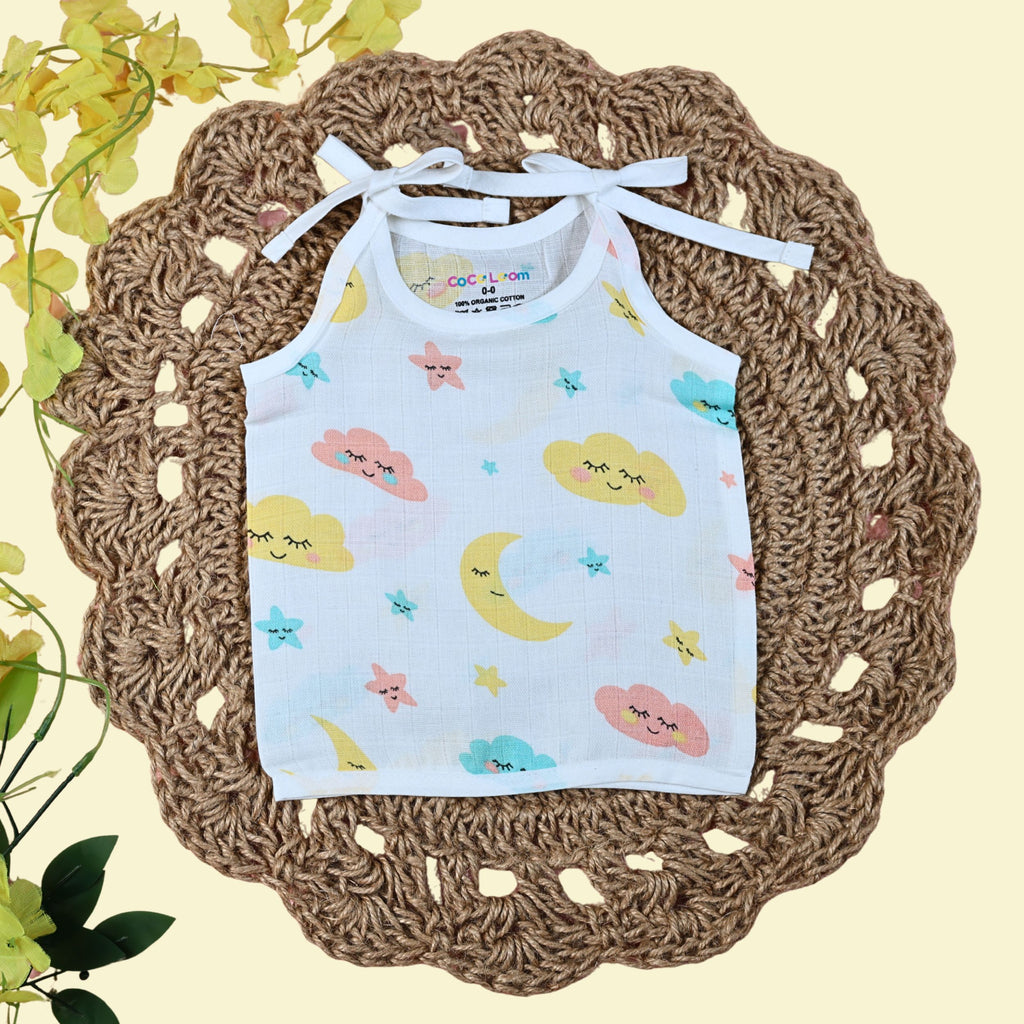 Twinkle Sky baby top in white with tie up shoulders printed with clouds, stars and moon design 