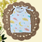 Twinkle Sky baby top in white with tie up shoulders printed with clouds, stars and moon design 