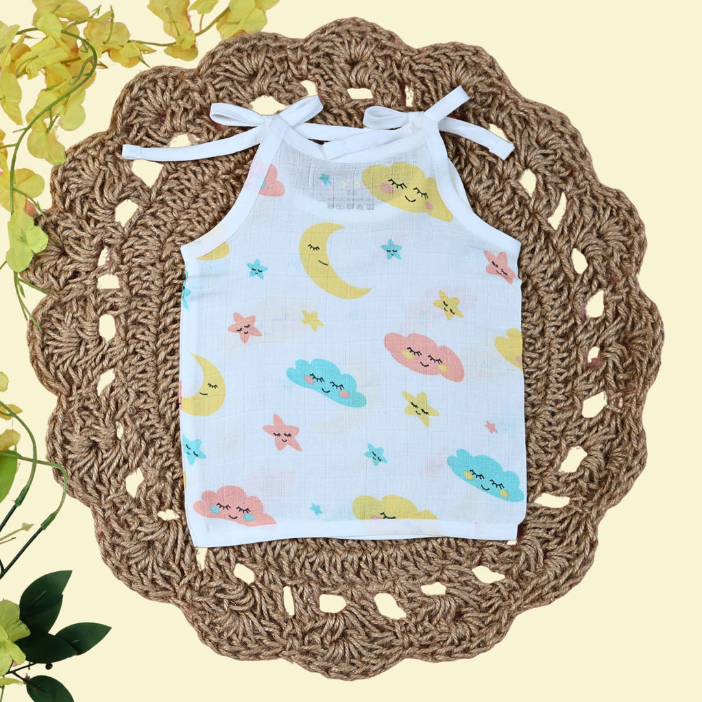 Twinkle Sky baby top in white with tie up shoulders printed with clouds, stars and moon design 