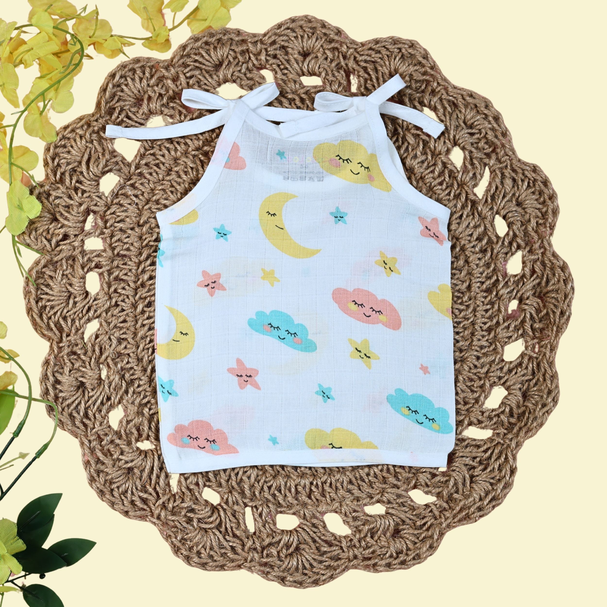 Twinkle Sky baby top in white with tie up shoulders printed with clouds, stars and moon design 