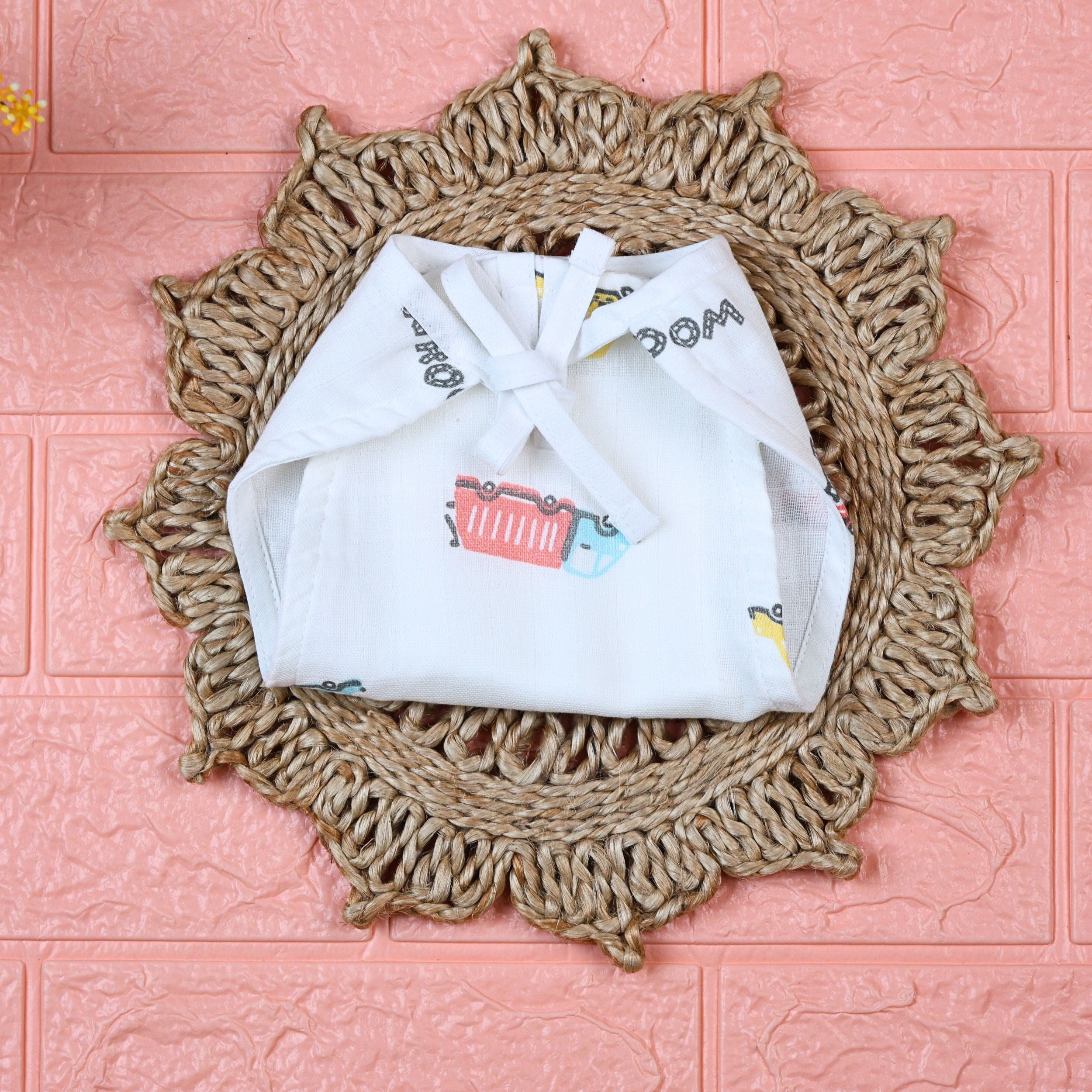 Beed Rides Baby Nappy in white with tie up knots, printed with vehicle patterns