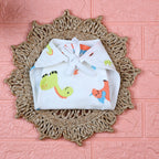Little Dino Baby Nappy in white with tie up knot, printed with orange and green dinosaur design
