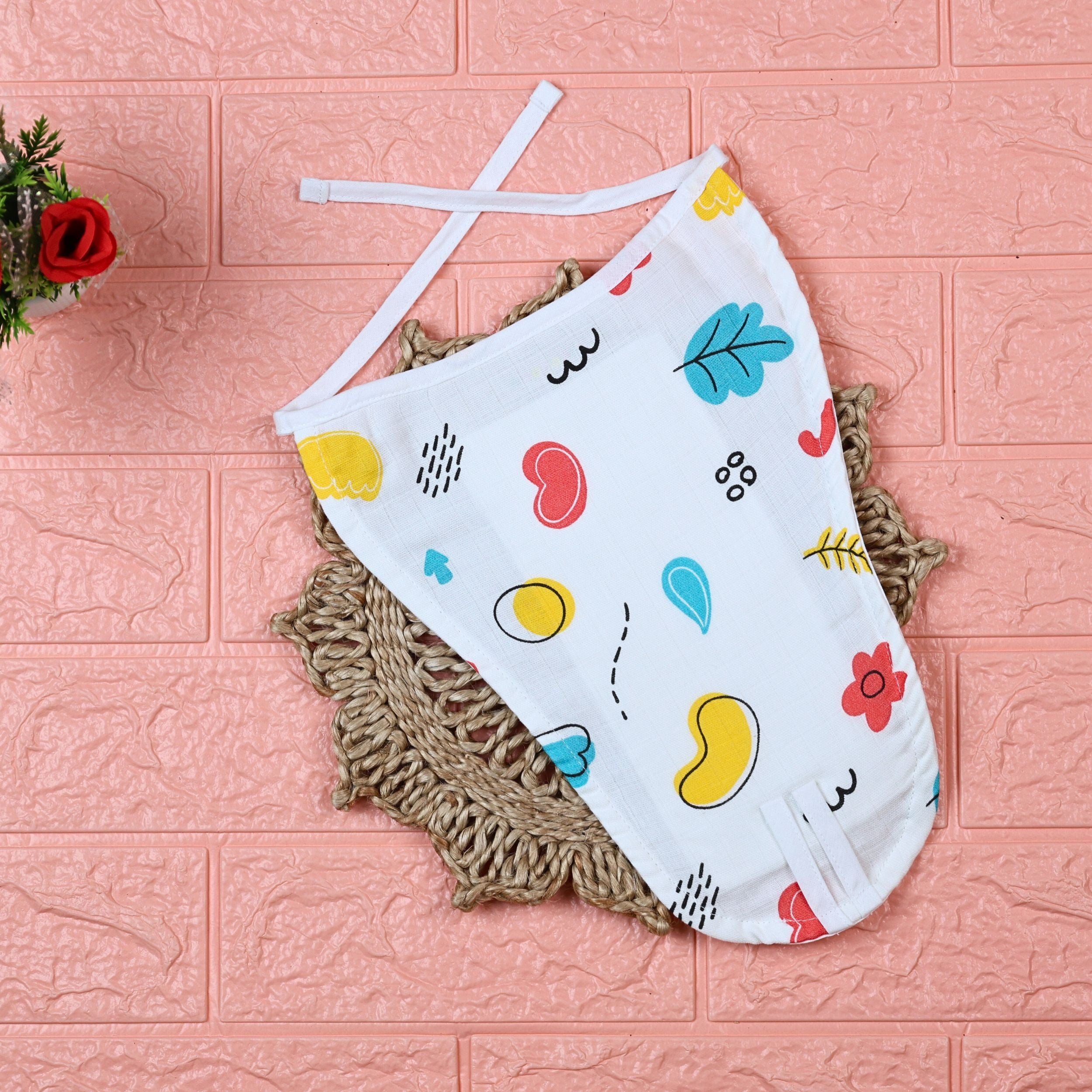 Wild Doodles Baby Nappy in white with tie up knots, printed with yellow, red and pastel green scribble patterns.
