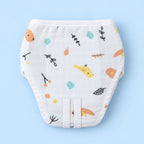 A white reusable cloth diaper with a colorful nature-themed print of birds, flowers, leaves, and orange foxes, displayed flat against a light blue background.