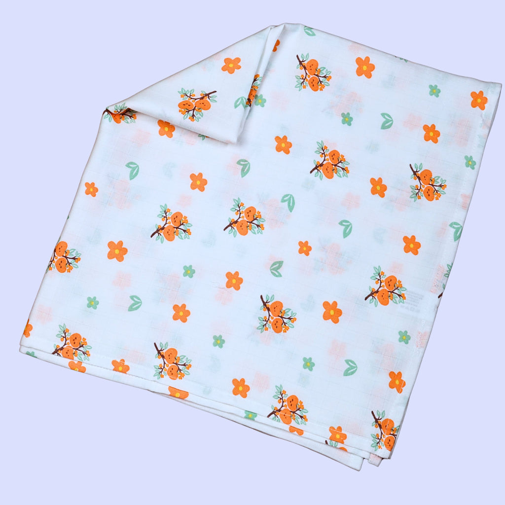 Citrus Bloom Baby Swaddle in white with mosquito net printed with orange floral patterns
