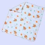 Citrus Bloom Baby Swaddle in white with mosquito net printed with orange floral patterns