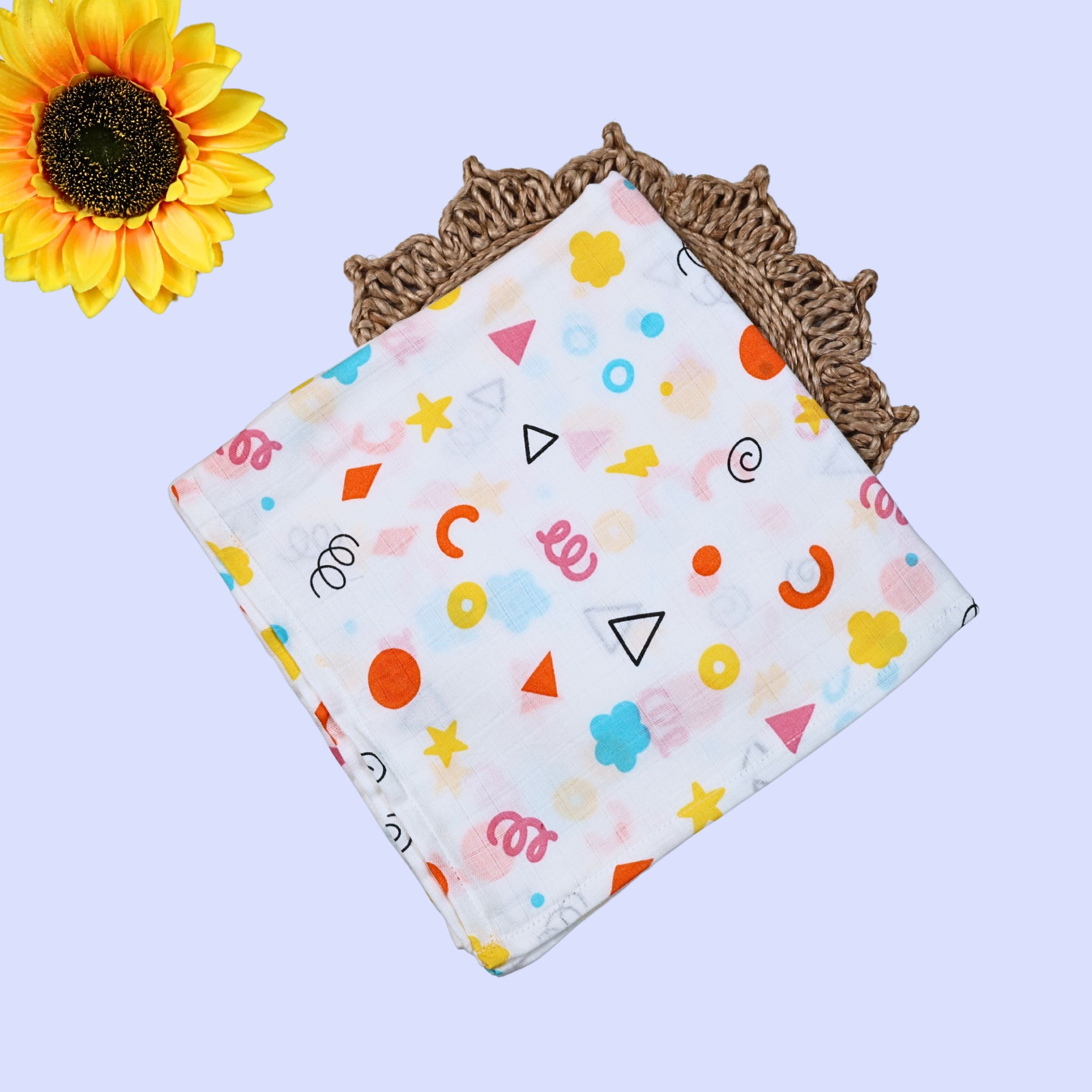 Colour Pops Baby Swaddle in white printed with colorful patterns