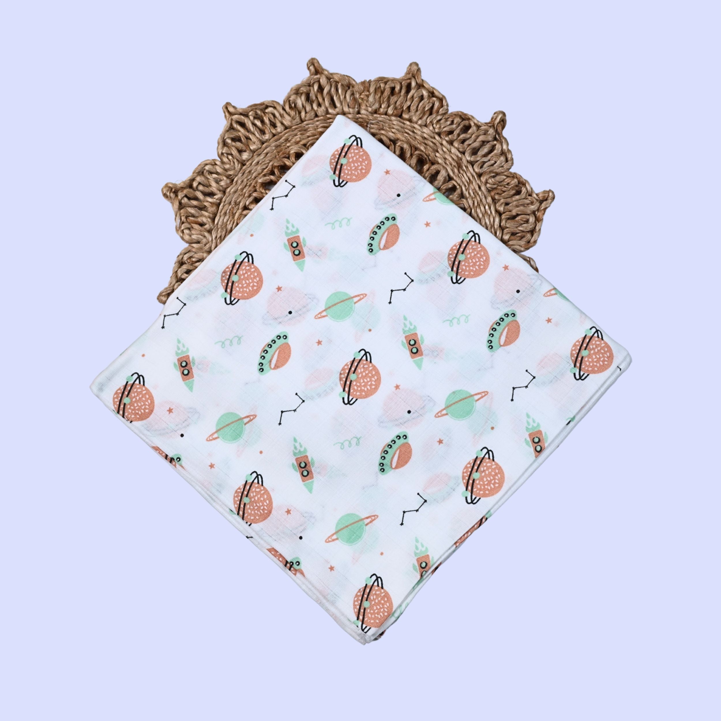 Cosmic Wonders Baby Swaddle in white printed with space-themed design