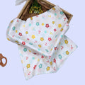 Flora Baby Swaddle in white printed with Floral pattern