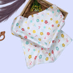 Flora Baby Swaddle in white printed with Floral pattern