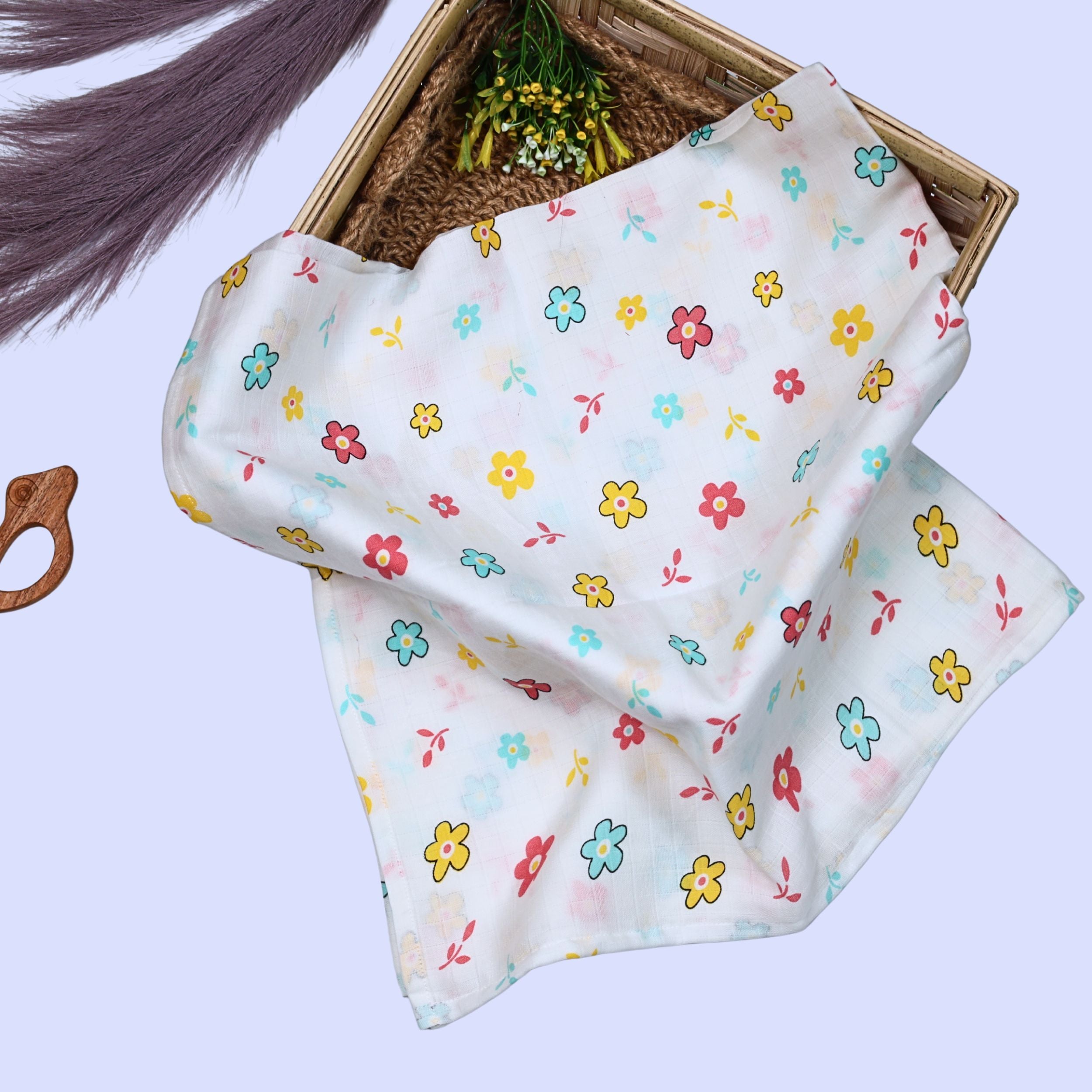 Flora Baby Swaddle in white printed with Floral pattern