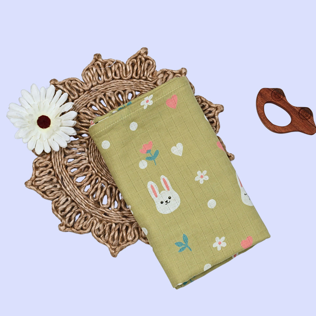 Hoppy Bunny Baby Swaddle in green with bunny design 