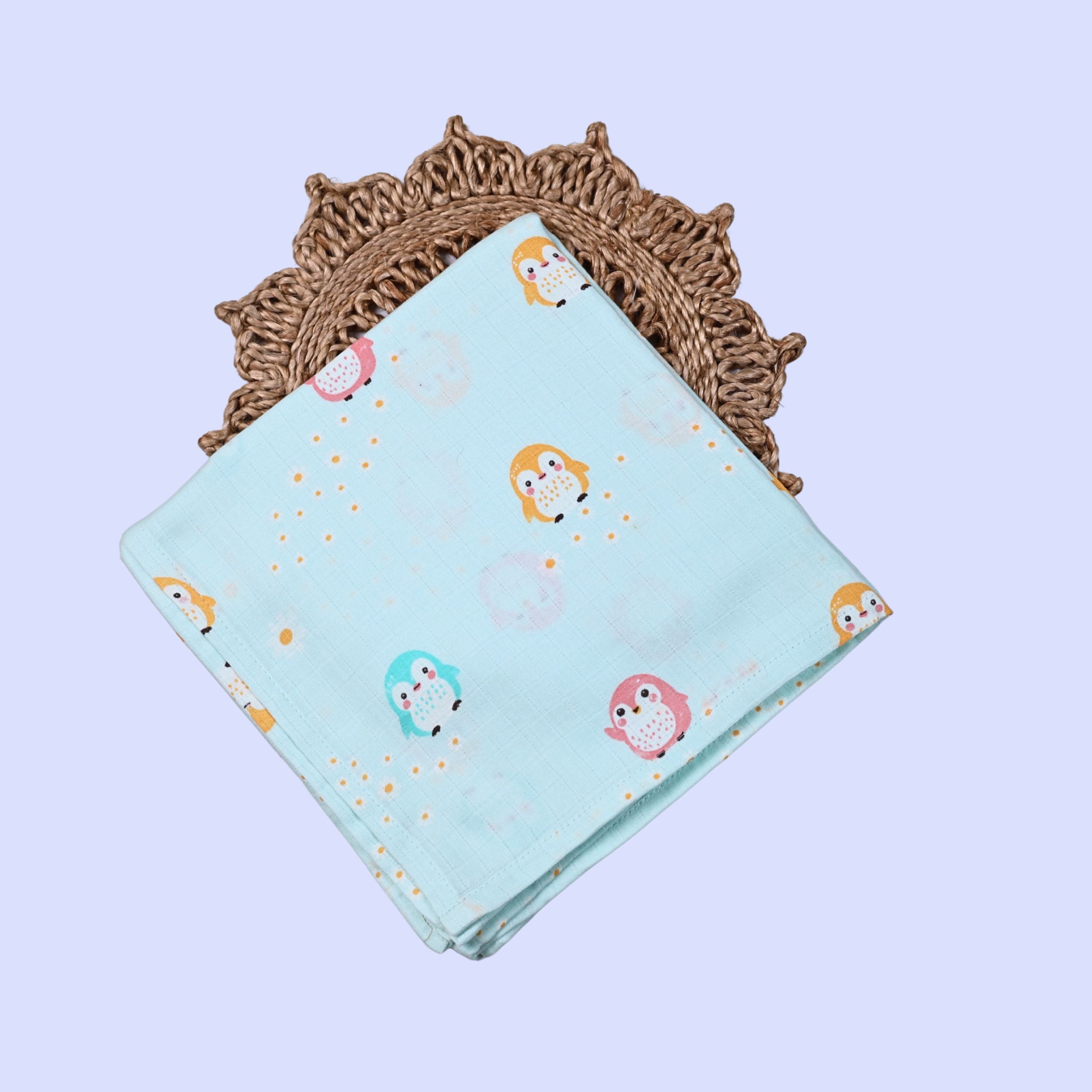 Peppy Penguins Baby Swaddle in pastel turquoise blue with colourful penguin patterns