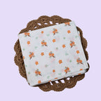 Citrus Bloom Baby Thottil (Jhula) in white with mosquito net printed with orange floral patterns