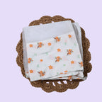 Citrus Bloom Baby Thottil (Jhula) in white with mosquito net printed with orange floral patterns