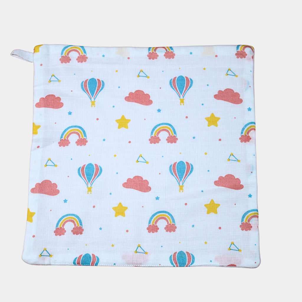 Rainbow Rides Baby Wipes in white printed with rainbow, cloud, and hot air balloon pattern